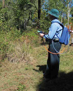 Demonstrating a splatter gun at a workshop