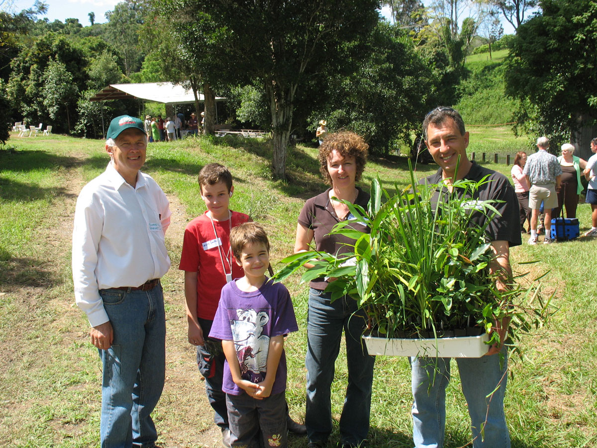 Family in photo with Land for Wildlife team member