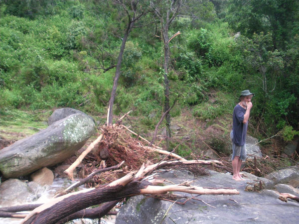James Kerr inspecting the changes to Spinach Creek after the devastating floods of January